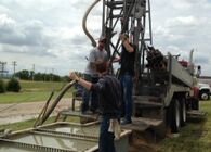 Monitoring Well Drillers Working in the Field